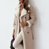 Elevate your style with this elegant, belted, long trench