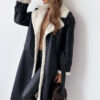 Elevate your style with this elegant, belted, long trench